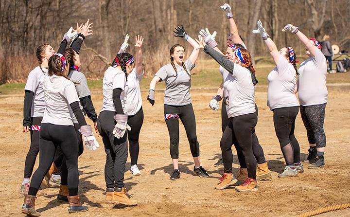 BW students April Reign tug of war team with arms raised